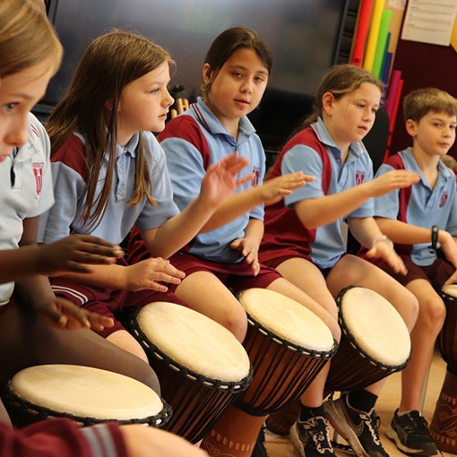 in_the_groove_education_students_drumming